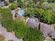 A captivating aerial view showcases a community pool and lush landscaping in this neighborhood at 3415 Starbird Dr, Ocoee, FL 34761