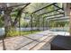 Large screened patio with brick pavers offers ample space for outdoor living and entertainment at 3415 Starbird Dr, Ocoee, FL 34761