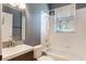 Traditional bathroom has a tub/shower combo, vanity with storage, and bright lighting at 3415 Starbird Dr, Ocoee, FL 34761