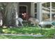 Front yard with two sandhill cranes enjoying the green grass at 3415 Starbird Dr, Ocoee, FL 34761