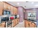 Kitchen with ample storage, black countertops, and stainless steel appliances at 3415 Starbird Dr, Ocoee, FL 34761