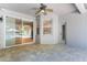 Covered patio featuring tile flooring, a ceiling fan, and sliding glass doors at 3415 Starbird Dr, Ocoee, FL 34761