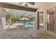 Enclosed patio featuring a screened-in pool area with lush landscaping, offering a private outdoor oasis at 3415 Starbird Dr, Ocoee, FL 34761