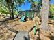 Community playground featuring climbing wall, slide, mulch ground cover and playground rules sign at 3415 Starbird Dr, Ocoee, FL 34761