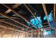 Exposed ceiling framing with damaged or missing insulation and blue tarp covering at 4421 Steed Ter, Winter Park, FL 32792