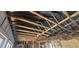 Exposed ceiling framing with damaged or missing insulation and wiring at 4421 Steed Ter, Winter Park, FL 32792