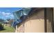 Exterior of home with significant tarp coverage due to damage, possibly from storm or fire at 4421 Steed Ter, Winter Park, FL 32792