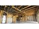 Partially finished home interior showing exposed framing and ceilings, wiring, and lighting with potential for customization at 4421 Steed Ter, Winter Park, FL 32792