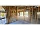 Open home interior featuring exposed wood framing and sliding doors providing seamless indoor-outdoor flow to pool area at 4421 Steed Ter, Winter Park, FL 32792
