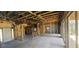 Home interior revealing exposed wood framing, concrete floors and sliding doors for an open living concept at 4421 Steed Ter, Winter Park, FL 32792