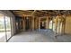Sunlit home interior showing exposed beams and frame offering potential for a spacious and airy living area at 4421 Steed Ter, Winter Park, FL 32792