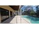 Inviting screened-in pool area with a generous patio, ideal for relaxation and recreation at 4421 Steed Ter, Winter Park, FL 32792