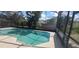 Refreshing screened-in pool offers a serene oasis with ample space for lounging and entertainment at 4421 Steed Ter, Winter Park, FL 32792
