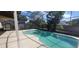 Relaxing screened-in pool area with a spacious deck, perfect for outdoor enjoyment and entertaining at 4421 Steed Ter, Winter Park, FL 32792