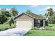 Charming single-Gathering home with a neutral color palette, stone accents, and well-maintained landscaping at 4645 Barberry Ave, Lakeland, FL 33811