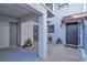 Inviting entrance with tiled courtyard, lush plants, and secure gated entryway at 5122 Cypress Creek Dr # 103, Orlando, FL 32811