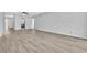 Open-concept living area with updated flooring, neutral paint, and abundant natural light at 5122 Cypress Creek Dr # 103, Orlando, FL 32811