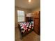 bedroom with bunkbeds and carpet flooring with a window for natural lighting at 5520 Solterra Cir, Davenport, FL 33837