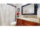 Bathroom featuring granite countertop vanity and floral shower curtain at 650 N 4Th Ave, Deltona, FL 32725