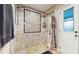 Shower room with beige tiles, glass door and chrome shower head at 650 N 4Th Ave, Deltona, FL 32725