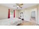 Comfortable bedroom featuring a ceiling fan and bright natural lighting at 650 N 4Th Ave, Deltona, FL 32725