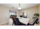 Well-lit dining area with a view into the living room and kitchen at 650 N 4Th Ave, Deltona, FL 32725