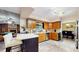 Well-lit kitchen area with wood cabinets and stone tile flooring at 650 N 4Th Ave, Deltona, FL 32725