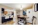 Open kitchen and breakfast nook with access to other rooms at 650 N 4Th Ave, Deltona, FL 32725