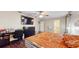 Spacious main bedroom offers a work space, wood floor and ceiling fan at 650 N 4Th Ave, Deltona, FL 32725