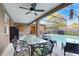 Relaxing screened-in patio with comfortable seating and a view of the pool at 650 N 4Th Ave, Deltona, FL 32725