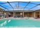 Backyard pool and patio area with ample seating and a relaxing view at 650 N 4Th Ave, Deltona, FL 32725