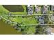 Generous lot with waterfront access and mature trees, offering a peaceful and private setting at 703 Valencia Shores Dr, Winter Garden, FL 34787