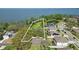 Lakefront land view of the property near a pond and neighboring homes at 703 Valencia Shores Dr, Winter Garden, FL 34787
