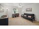 Bright bedroom with a futon, ceiling fan, and plenty of natural light at 703 Valencia Shores Dr, Winter Garden, FL 34787