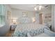 Cozy bedroom featuring white wicker furniture and floral bedding at 703 Valencia Shores Dr, Winter Garden, FL 34787