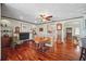 Open dining area with hardwood floors, fireplace and views to the living room at 703 Valencia Shores Dr, Winter Garden, FL 34787