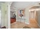 Inviting foyer featuring beautiful tile flooring, columns, archways and eye-catching art pieces at 703 Valencia Shores Dr, Winter Garden, FL 34787