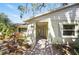 Charming entrance with a stone walkway, colorful plants, and a covered entryway at 703 Valencia Shores Dr, Winter Garden, FL 34787