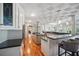 Expansive kitchen with an island, breakfast bar, stone countertops and stainless steel appliances at 703 Valencia Shores Dr, Winter Garden, FL 34787