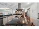Open kitchen with a large island, granite countertops, stainless steel appliances at 703 Valencia Shores Dr, Winter Garden, FL 34787