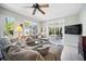 Comfortable living room with lots of natural light and patio access at 703 Valencia Shores Dr, Winter Garden, FL 34787