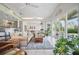 Open living area featuring tile flooring, neutral color scheme, decorative ceilings, and natural light at 703 Valencia Shores Dr, Winter Garden, FL 34787