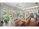 Open floor plan living room offering natural light, views of the garden and comfortable seating at 703 Valencia Shores Dr, Winter Garden, FL 34787