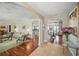 Elegant living room with hardwood floors, decorative ceilings, and open archways at 703 Valencia Shores Dr, Winter Garden, FL 34787