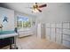 Spacious office with tile flooring, storage units, and ample natural light at 703 Valencia Shores Dr, Winter Garden, FL 34787