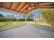 Screened patio offering views of the green lawn and lush landscaping at 703 Valencia Shores Dr, Winter Garden, FL 34787