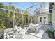 Relaxing screened porch with a dining table is surrounded by greenery and natural light at 703 Valencia Shores Dr, Winter Garden, FL 34787