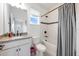 Clean bathroom with modern fixtures, a vanity, and a shower-tub combo with white tile at 737 Hyperion Dr, Debary, FL 32713