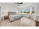 Bright bedroom with a large bed, ceiling fan, and big windows offering natural light at 737 Hyperion Dr, Debary, FL 32713