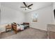 A simple bedroom featuring a wood-framed bed and a window providing natural light at 737 Hyperion Dr, Debary, FL 32713